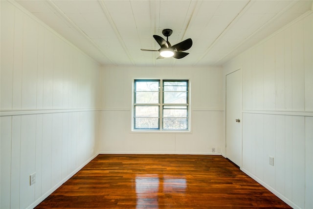 unfurnished room featuring ceiling fan and dark hardwood / wood-style flooring