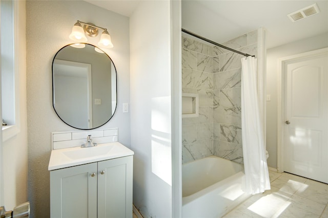 bathroom featuring vanity and shower / bath combo