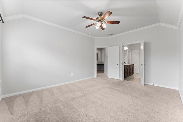 unfurnished bedroom with connected bathroom, crown molding, vaulted ceiling, light carpet, and ceiling fan