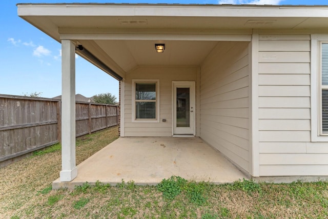 doorway to property with a patio