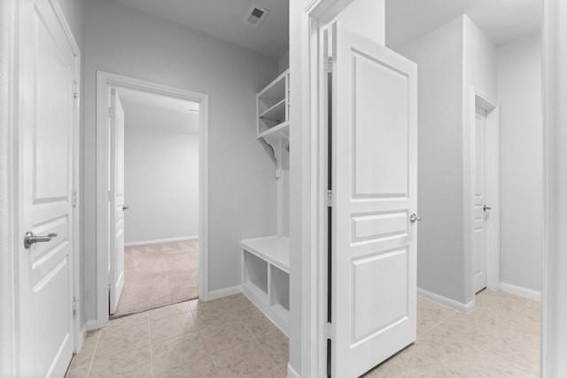 mudroom with light tile patterned floors