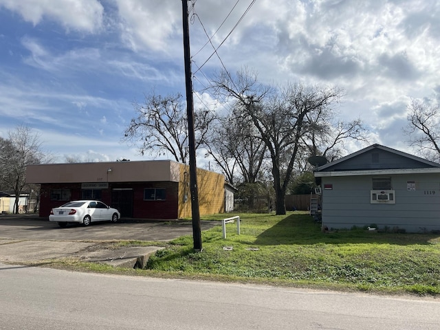 exterior space with a carport and a front yard