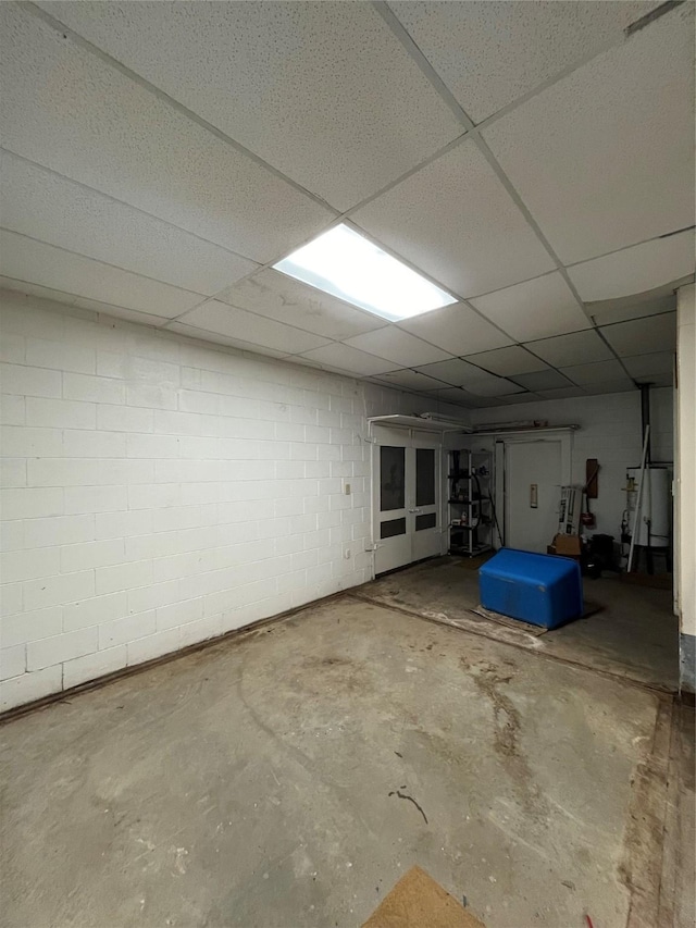 basement featuring a paneled ceiling