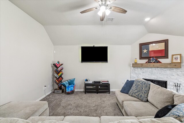 carpeted living room featuring vaulted ceiling, ceiling fan, and a fireplace