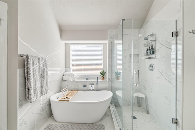 bathroom featuring tile walls, shower with separate bathtub, and a textured ceiling