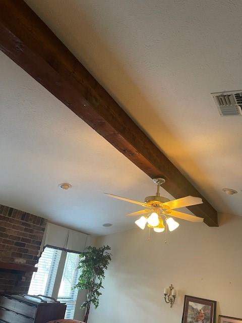 interior details with beam ceiling and ceiling fan