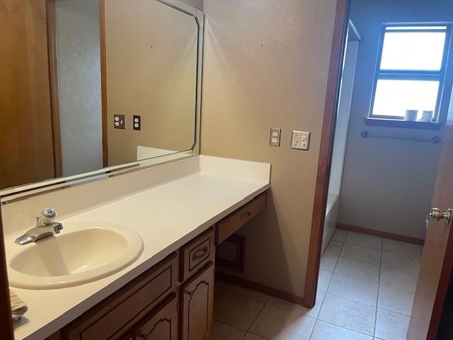 bathroom with vanity and tile patterned floors