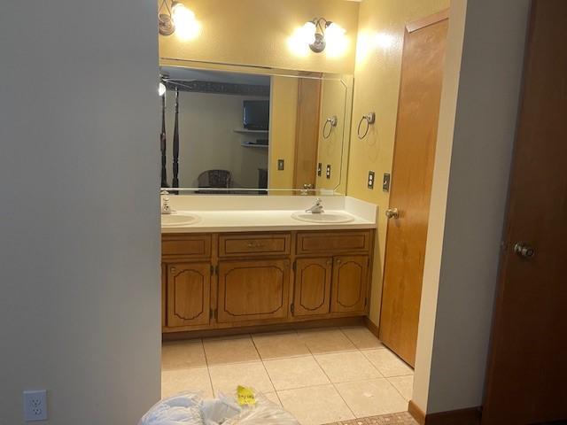 bathroom with vanity and tile patterned floors