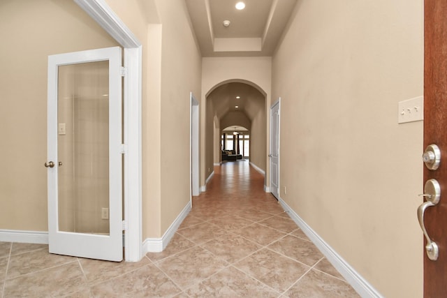 corridor featuring light tile patterned flooring