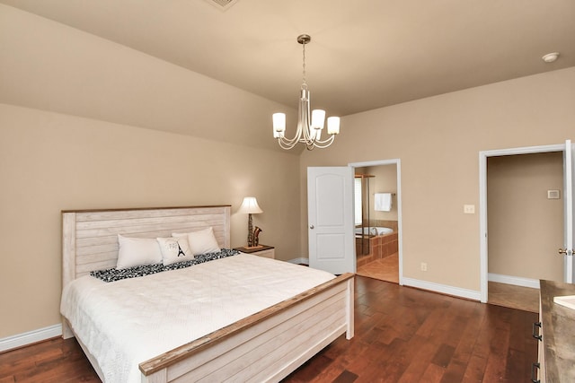 bedroom with connected bathroom, dark hardwood / wood-style floors, and a chandelier