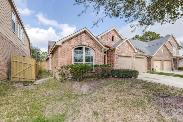 view of front of home with a garage and a front lawn