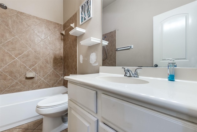 full bathroom featuring tile patterned flooring, vanity, tiled shower / bath combo, and toilet