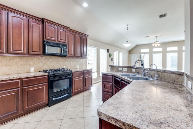 kitchen featuring pendant lighting, sink, light tile patterned floors, backsplash, and black appliances