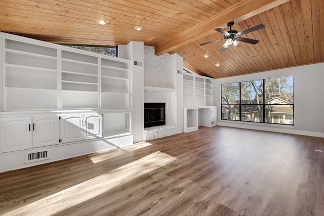 unfurnished living room with wood ceiling, wood-type flooring, lofted ceiling with beams, a large fireplace, and built in shelves