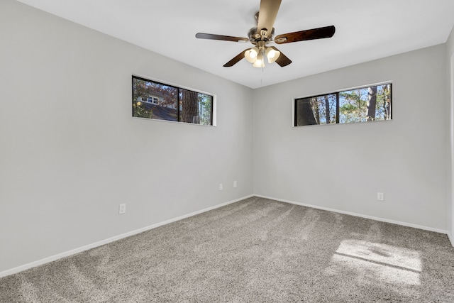 carpeted empty room with ceiling fan