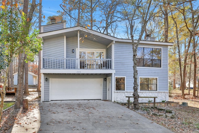 view of front of house with a balcony and a garage