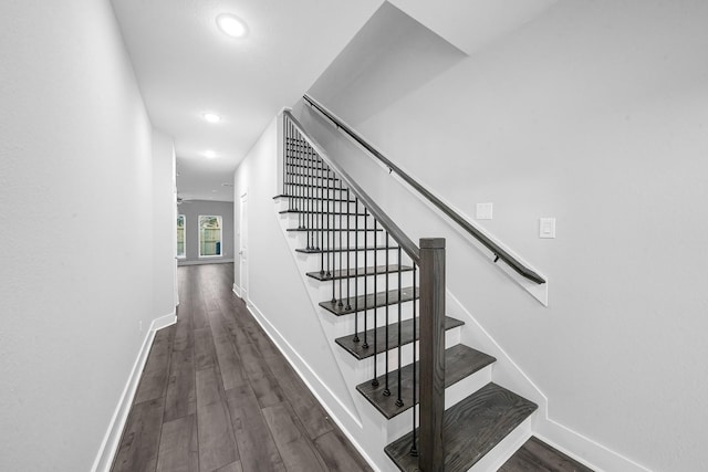 stairway with hardwood / wood-style flooring