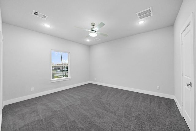 carpeted spare room with ceiling fan