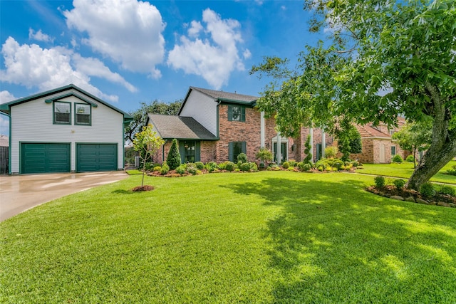 view of front of home featuring a garage and a front yard