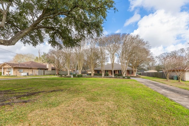 ranch-style home with a front yard