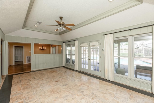 spare room with ornamental molding, a healthy amount of sunlight, and a textured ceiling