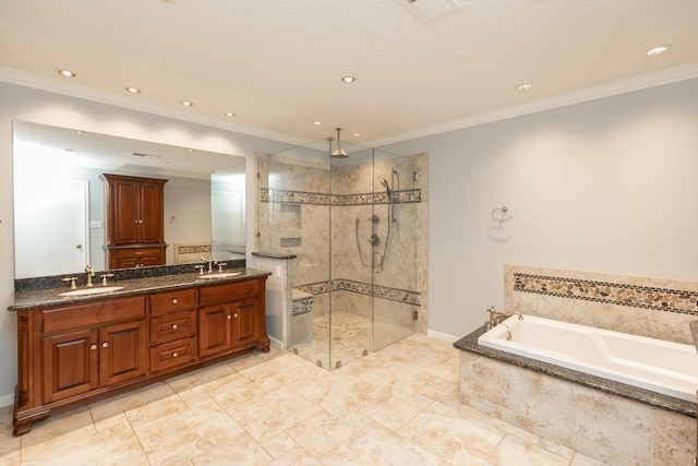 bathroom with ornamental molding, independent shower and bath, and vanity