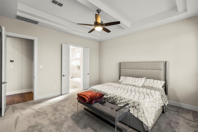 bedroom featuring ensuite bathroom, carpet floors, ceiling fan, and beam ceiling