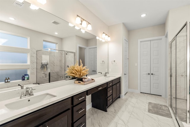 bathroom featuring vanity and an enclosed shower