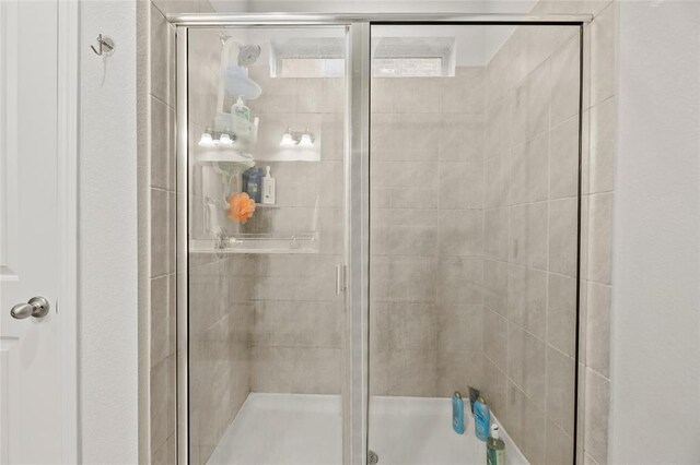 bathroom with an enclosed shower