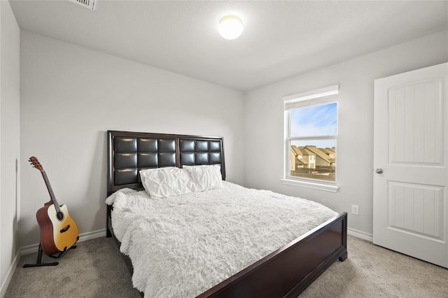 bedroom featuring carpet