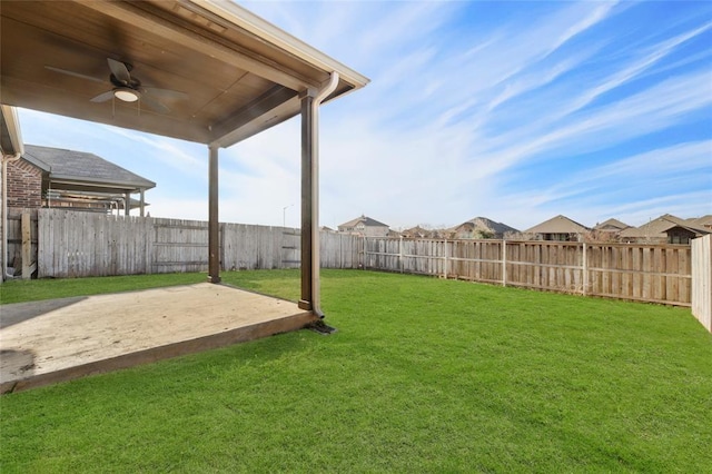 view of yard featuring ceiling fan and a patio area