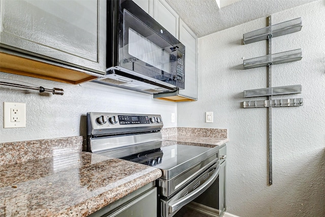 kitchen featuring stainless steel electric range