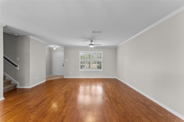 unfurnished living room with wood-type flooring, ornamental molding, and ceiling fan