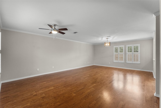 spare room with crown molding, ceiling fan with notable chandelier, and dark hardwood / wood-style floors