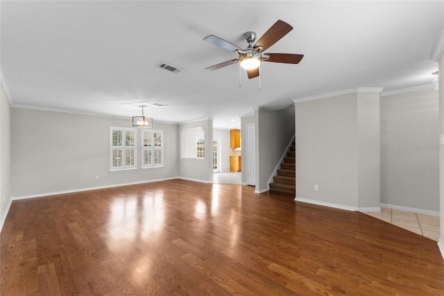 unfurnished living room featuring crown molding, wood-type flooring, and ceiling fan