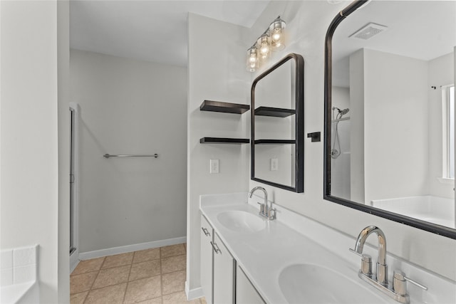 bathroom featuring vanity, tile patterned floors, and a shower with door