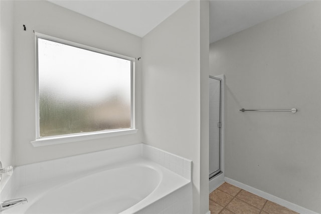 bathroom with tile patterned flooring and plus walk in shower