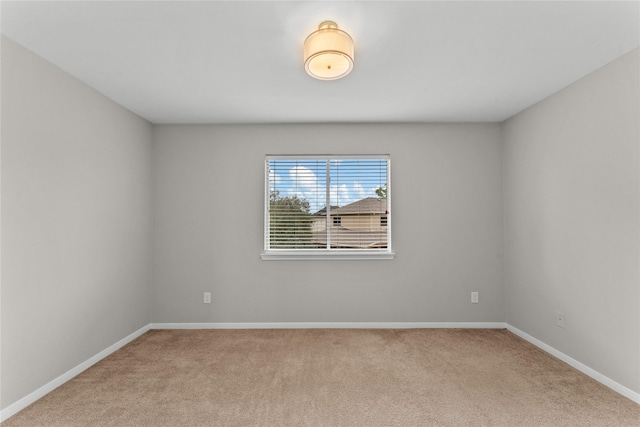 empty room with light colored carpet