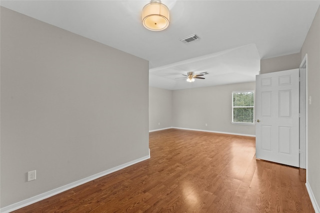 empty room featuring ceiling fan and wood-type flooring