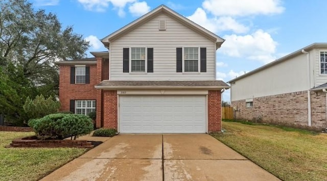 front facade featuring a garage and a front yard