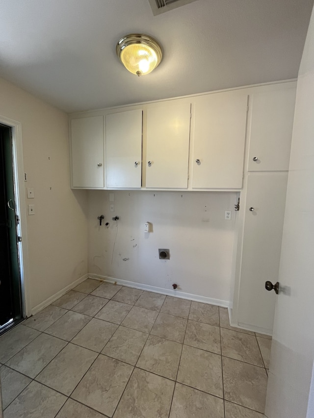 laundry room with cabinets, washer hookup, hookup for an electric dryer, and light tile patterned floors