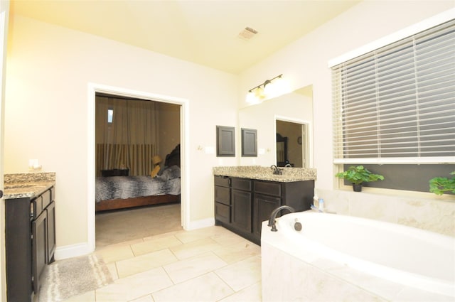 full bath featuring visible vents, connected bathroom, vanity, a bath, and tile patterned floors