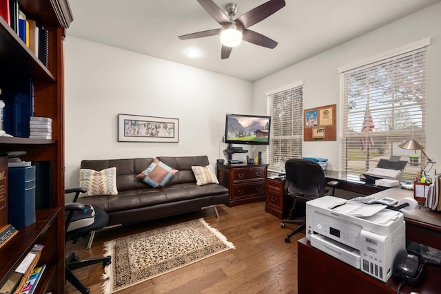 office area with wood finished floors and a ceiling fan