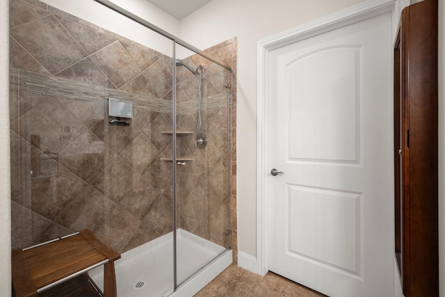 full bath with a shower stall