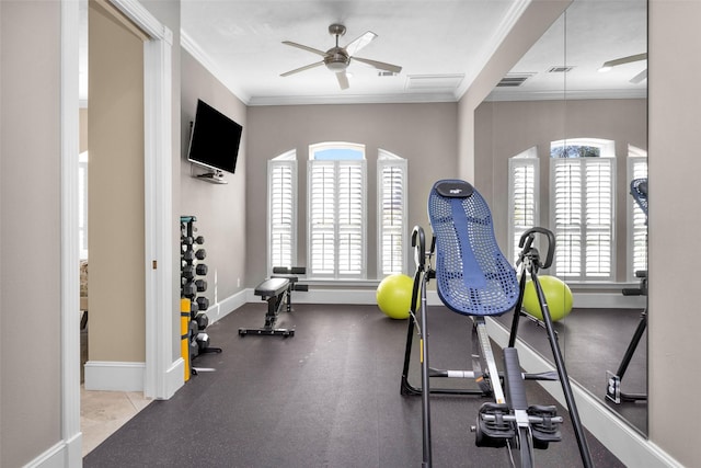 exercise room featuring plenty of natural light, ornamental molding, and ceiling fan