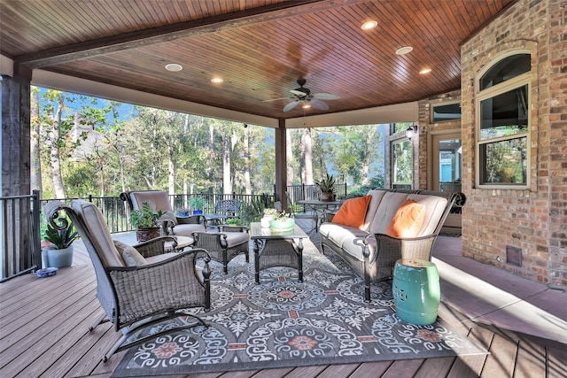 deck featuring an outdoor living space and ceiling fan