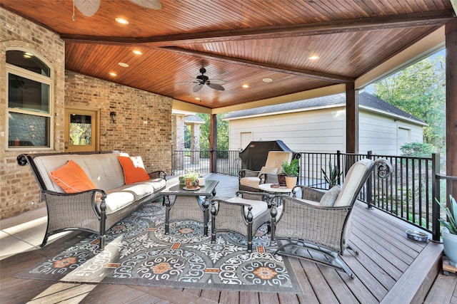 wooden deck with ceiling fan, an outdoor living space, and area for grilling