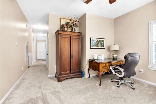 home office with ceiling fan and light carpet