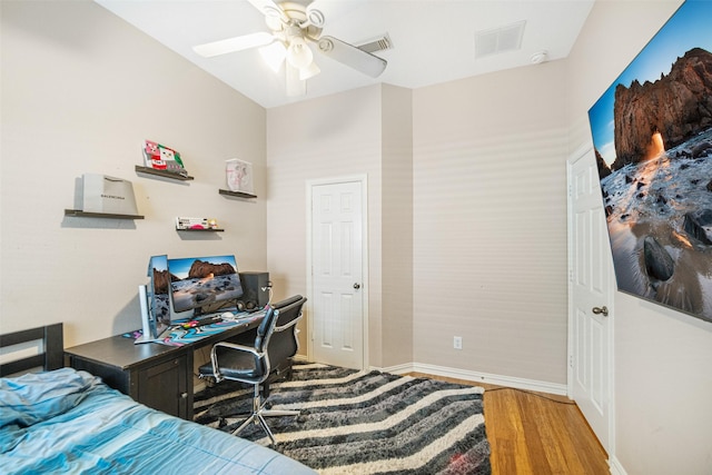 bedroom with hardwood / wood-style flooring and ceiling fan