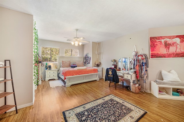 bedroom with hardwood / wood-style flooring and ceiling fan